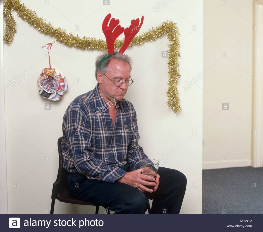 man-alone-at-christmas-party-wearing-antlers-AF8N12.jpg