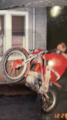 Layne doing wheelie on Gas-Gas outside of Bobby-os house.