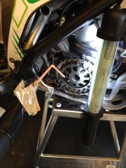 If you loose the rubber pin behind clutch basket, vacuum hose with a straw works